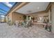 Relaxing outdoor patio with seating area and lush landscaping, adjacent to pool at 9146 Sw 65Th Loop, Ocala, FL 34481