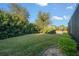 Landscaped side yard with well-manicured lawn and hedges at 9146 Sw 65Th Loop, Ocala, FL 34481