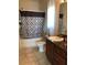 Updated bathroom with tub shower and new vanity at 9781 Sw 57Th Ave, Ocala, FL 34476