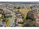 Residential home situated in a neighborhood near a golf course and water features at 12157 Se 175Th Loop, Summerfield, FL 34491