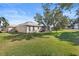 View of home's exterior and expansive backyard at 12157 Se 175Th Loop, Summerfield, FL 34491