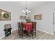 Charming dining room with a table for six and hardwood floors at 12157 Se 175Th Loop, Summerfield, FL 34491