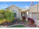 Home's front entrance with landscaping and a three-car garage at 12157 Se 175Th Loop, Summerfield, FL 34491