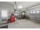 Organized garage with overhead storage and workbenches at 12157 Se 175Th Loop, Summerfield, FL 34491