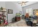 Home office with hardwood floors, comfortable seating, and built-in shelving at 12157 Se 175Th Loop, Summerfield, FL 34491
