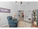 Bright home office with hardwood floors, comfortable seating, and French doors at 12157 Se 175Th Loop, Summerfield, FL 34491