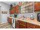Kitchen features double sink, wood cabinets, and updated countertops at 12157 Se 175Th Loop, Summerfield, FL 34491