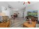 Open living space with hardwood floors, a seating area and views into dining area at 12157 Se 175Th Loop, Summerfield, FL 34491