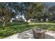 Stone patio with fire pit in a backyard setting at 12157 Se 175Th Loop, Summerfield, FL 34491