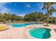 Relax by the pool and spa with plenty of lounge chairs at 12157 Se 175Th Loop, Summerfield, FL 34491