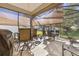 Covered patio with seating area and shade screens at 12157 Se 175Th Loop, Summerfield, FL 34491