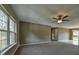 Spacious living room with neutral carpeting and large window at 14543 Sw 79Th Avenue Rd, Ocala, FL 34473