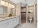 Elegant bathroom with double vanity and a walk-in shower at 1637 Sw 168Th Loop, Ocala, FL 34473