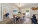 Charming dining room with a rustic wooden table and blue chairs at 1637 Sw 168Th Loop, Ocala, FL 34473