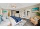Main bedroom with ensuite bathroom access and large windows at 1637 Sw 168Th Loop, Ocala, FL 34473