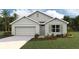 One-story home with a two-car garage and landscaped front yard at 296 Hickory Course Trl, Ocala, FL 34472