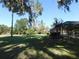 Large backyard with grassy area and oak trees at 3282 Sw 9Th Ave, Ocala, FL 34471