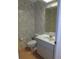 Small half bathroom with floral wallpaper and vanity at 3282 Sw 9Th Ave, Ocala, FL 34471