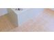 Light peach tiled bathroom floor and bathtub at 3282 Sw 9Th Ave, Ocala, FL 34471