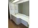 Bathroom featuring a vanity with drawers and a large mirror at 3282 Sw 9Th Ave, Ocala, FL 34471