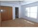 Bright bedroom with ceiling fan, large closet, and carpet at 3282 Sw 9Th Ave, Ocala, FL 34471
