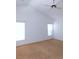 Spacious bedroom with vaulted ceiling, carpet, and multiple windows at 3282 Sw 9Th Ave, Ocala, FL 34471