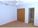 Well-lit bedroom with ceiling fan and en-suite bathroom at 3282 Sw 9Th Ave, Ocala, FL 34471
