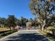 Gated community entrance with lush landscaping at 3282 Sw 9Th Ave, Ocala, FL 34471