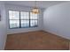 Dining room with carpeted floor and large window at 3282 Sw 9Th Ave, Ocala, FL 34471