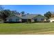 One-story home with green shutters and spacious lawn at 3282 Sw 9Th Ave, Ocala, FL 34471