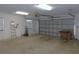 Spacious two-car garage with overhead storage and utility sink at 3282 Sw 9Th Ave, Ocala, FL 34471