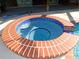 Relaxing hot tub with brick surround at 3282 Sw 9Th Ave, Ocala, FL 34471