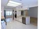 Open kitchen with stainless steel appliances and breakfast bar at 3282 Sw 9Th Ave, Ocala, FL 34471