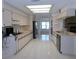 Updated kitchen with ample cabinetry and tile floors at 3282 Sw 9Th Ave, Ocala, FL 34471