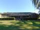 Screened-in pool area with lush landscaping at 3282 Sw 9Th Ave, Ocala, FL 34471
