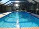 Inviting screened pool with brick coping and spacious deck at 3282 Sw 9Th Ave, Ocala, FL 34471