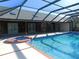 Inviting pool and spa with covered patio at 3282 Sw 9Th Ave, Ocala, FL 34471