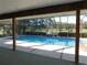 Relaxing pool area with covered patio at 3282 Sw 9Th Ave, Ocala, FL 34471