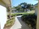Curving walkway leading to house exterior at 3282 Sw 9Th Ave, Ocala, FL 34471