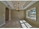 Bright dining room with tile floors and large window at 5 Fisher Terrace Way, Ocklawaha, FL 32179