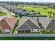 Aerial view of house and community, showcasing golf course views at 6292 Marnie Ter, The Villages, FL 32163