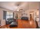 Living room with hardwood floors and a ceiling fan at 9255 Se 109Th Ln, Belleview, FL 34420