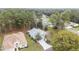 Aerial view showing home, landscaping, and surrounding trees at 11661 Sw 70Th Ct, Ocala, FL 34476