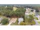 Aerial view of home nestled in wooded area near golf course at 11661 Sw 70Th Ct, Ocala, FL 34476