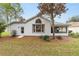 House exterior view with well maintained lawn at 11661 Sw 70Th Ct, Ocala, FL 34476
