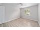 Bright bedroom with wood-look floors and a large window at 11661 Sw 70Th Ct, Ocala, FL 34476