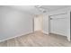 Simple bedroom with wood-look floors and spacious closet at 11661 Sw 70Th Ct, Ocala, FL 34476
