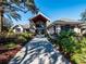 Elegant community clubhouse entrance with landscaping at 11661 Sw 70Th Ct, Ocala, FL 34476