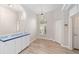 Light and airy dining area with wood-look flooring and a view to the entryway at 11661 Sw 70Th Ct, Ocala, FL 34476