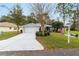 Single story home with attached garage and American flag at 11661 Sw 70Th Ct, Ocala, FL 34476